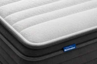 iSLEEP DELUXE mattress in a box compressed roll with scissors nearby